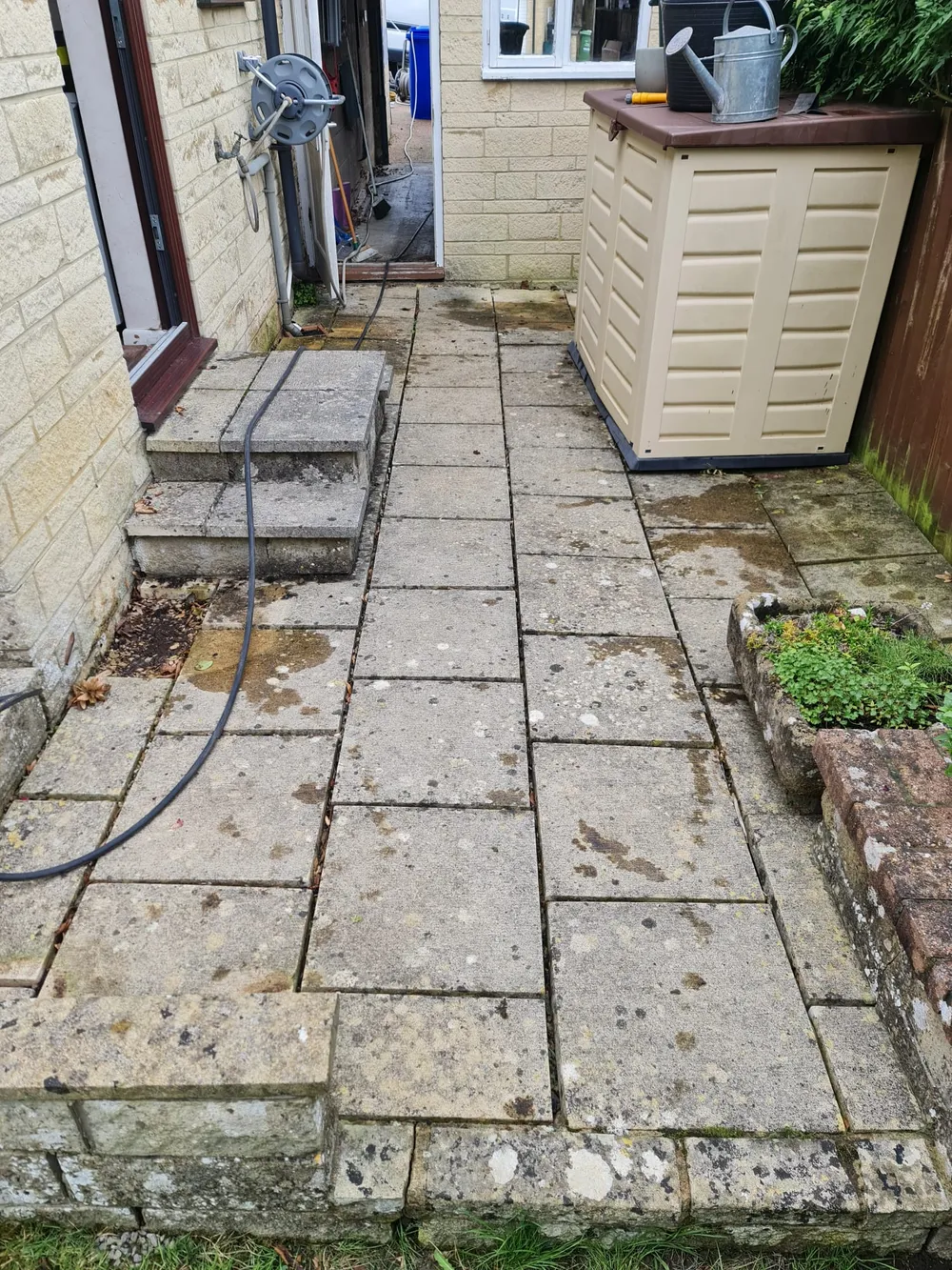 Patio slabs dirty and stained before cleaning